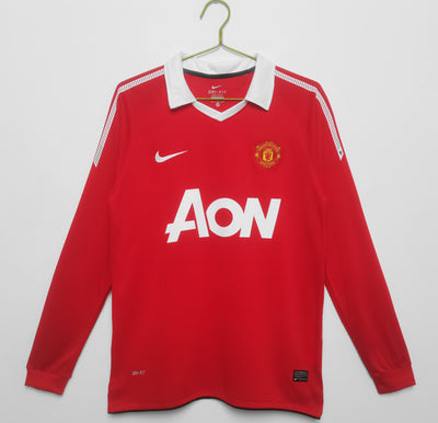 a manchester united shirt hanging on a hanger