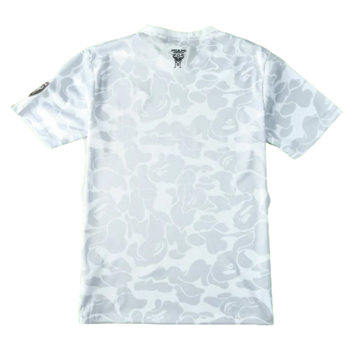 a white t - shirt with a camouflage print