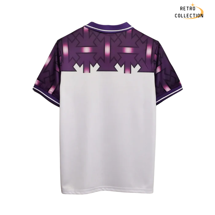 a purple and white t - shirt with arrows on it