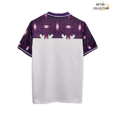 a purple and white t - shirt with arrows on it