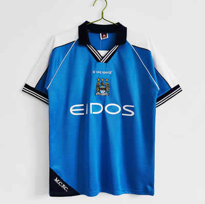 a soccer jersey hanging on a hanger