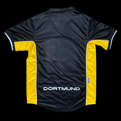 a black and yellow soccer jersey with the word dortmund on it