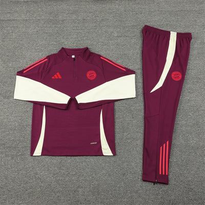 a maroon and white soccer uniform is laying on the ground