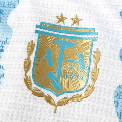 a blue and gold emblem on a white shirt