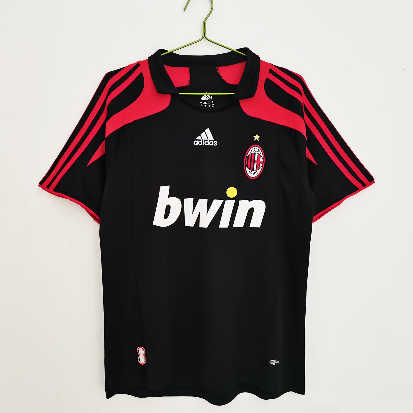 a soccer jersey hanging on a hanger