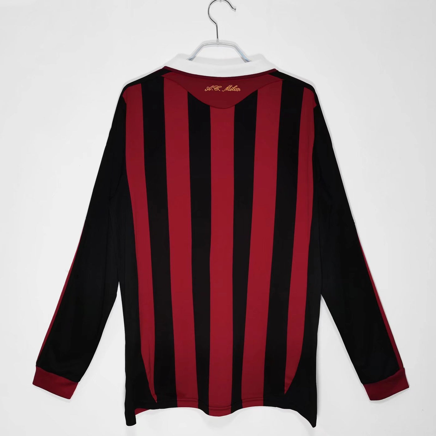 a black and red striped shirt hanging on a hanger