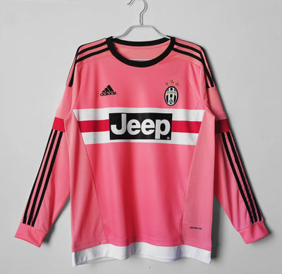 a pink jersey hanging on a hanger