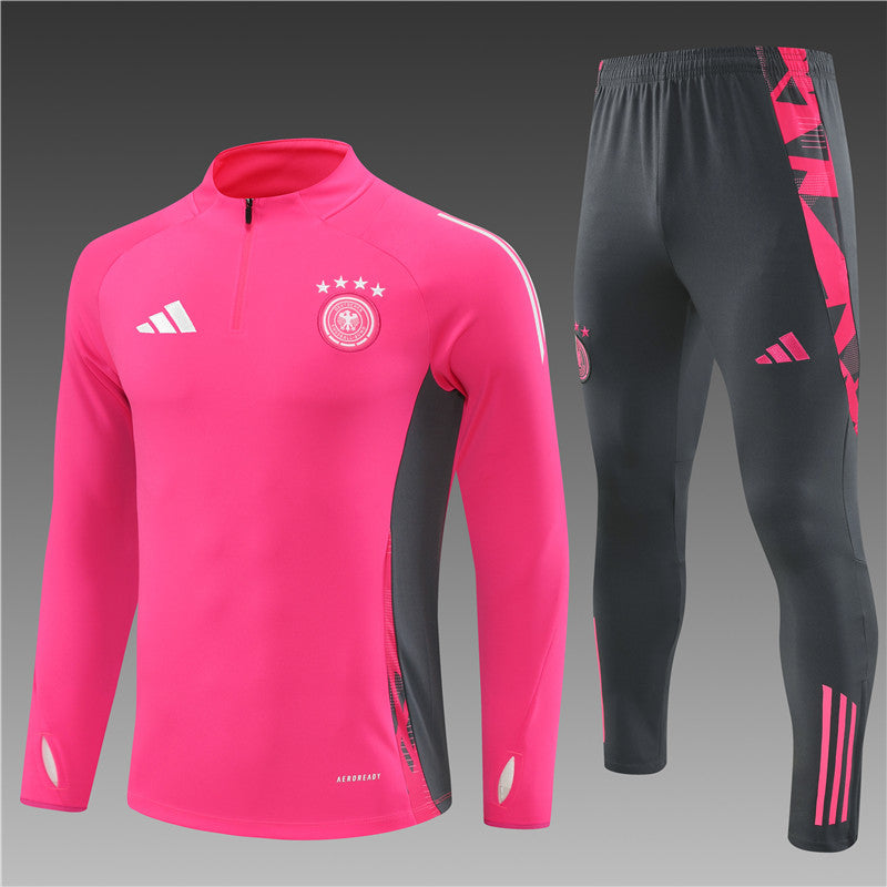 a pink and black soccer uniform and pants