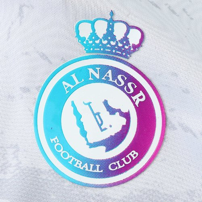 a close up of a soccer jersey with a crown on it