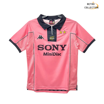 a pink jersey with a black collar and white collar